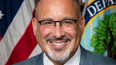 Dr. Miguel Cardona